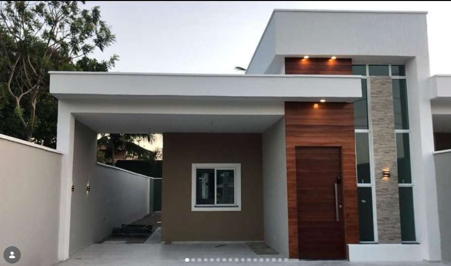 Residência de alto padrão entregue pela ALLS Engenharia com fachada em madeira e pedra